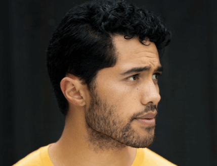 A close up image of Alex Tarrant with his side profile.