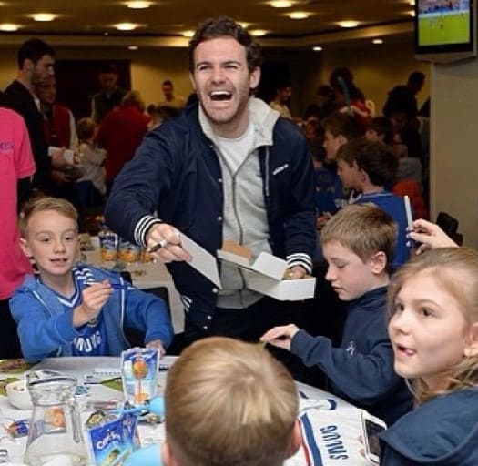 juan-mata-personallife-image Juan Mata with the Bridge kids celebrating Christmas party with the kids.