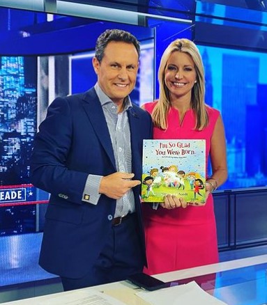 Ainsley Earhardt with her co-host at Fox News