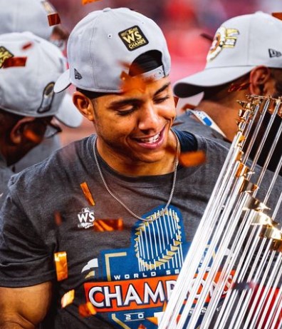 jeremy-pena-holding-world-series-champion-trouphy Jeremy Pena holding the world series champion trophy