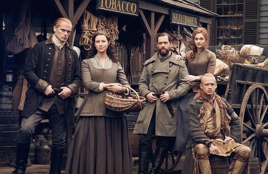 Sophie Skelton with the cast of Outlander