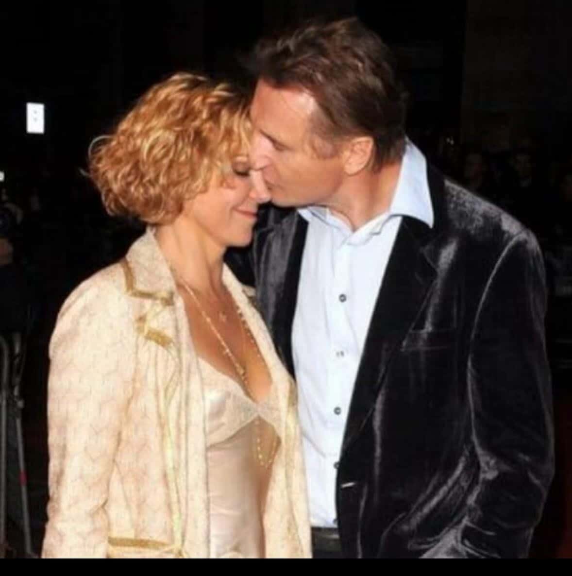 Liam Neeson kissing his late wife Natasha Richardson.