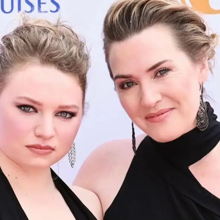 Kate Winslet and her daughter, Mia Threapleton, both with blonde hair, dressed in black and attending an event.