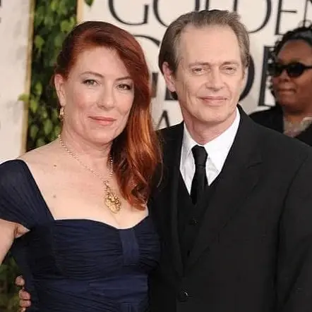 Jo Andres and Steve Buscemi standing together at a formal event.