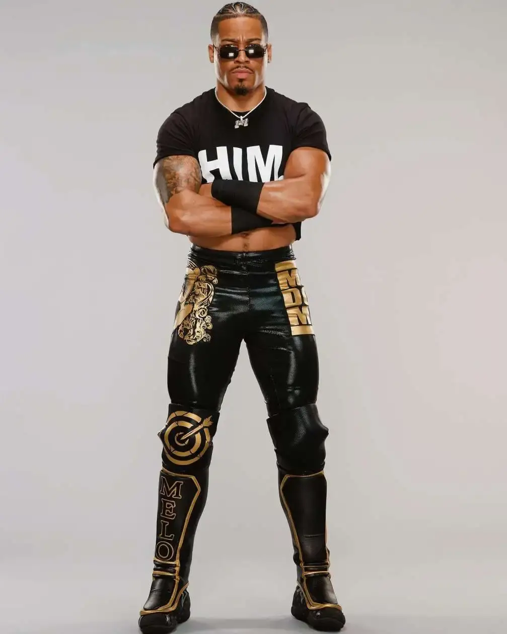Professional wrestler Carmelo Hayes posing in a black cropped 