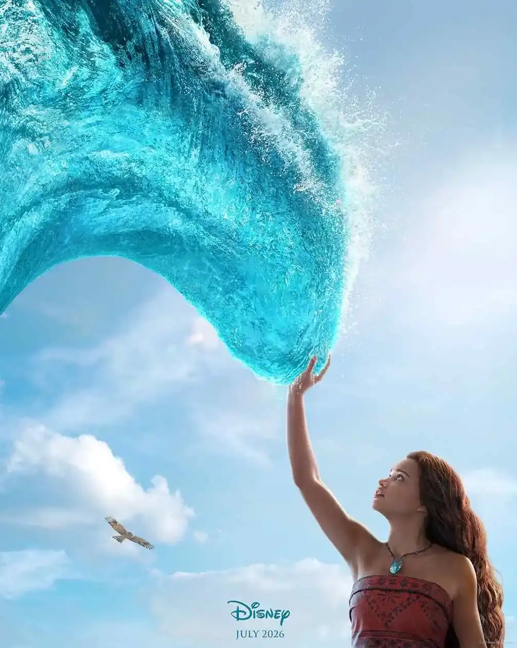 Catherine Laga’aia as Moana reaching up to touch a large, glowing blue wave under a bright sky with a bird flying nearby.