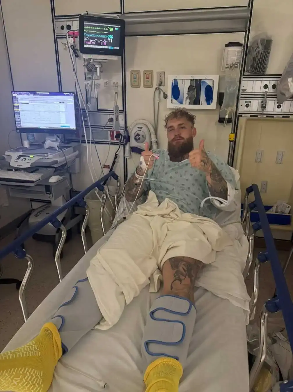 Jake Paul rests in a hospital bed at the University of Miami Hospital while recovering from surgery for a double broken jaw sustained during his fight with Anthony Joshua.