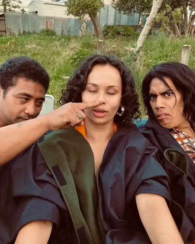 Dimitrius Schuster-Koloamatangi, Beulah Koale, and Frankie Adams pose for a playful, candid outdoor photo.