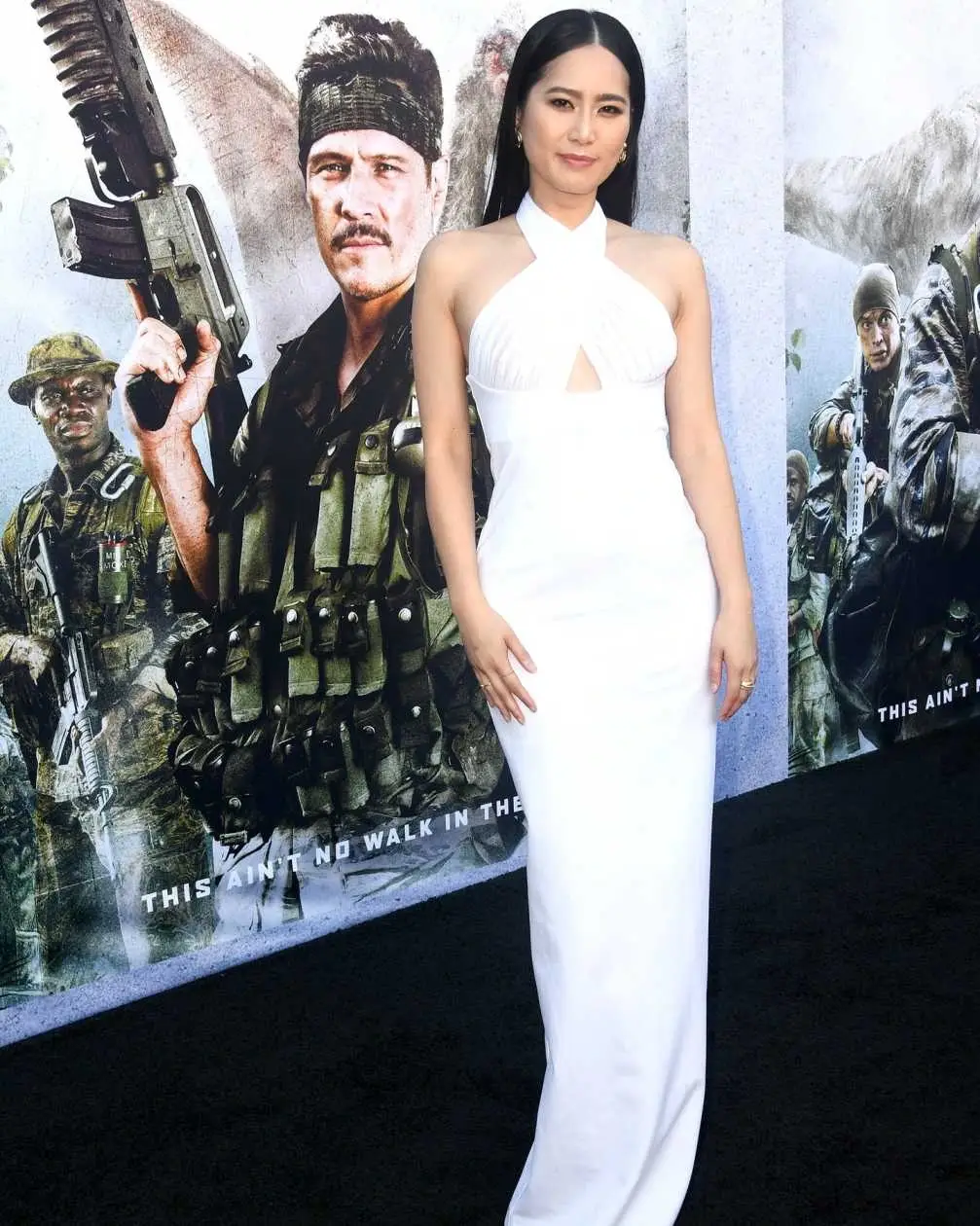 Ana Thu Nguyen poses in a white halter-neck gown at the Los Angeles premiere of "Primitive War."