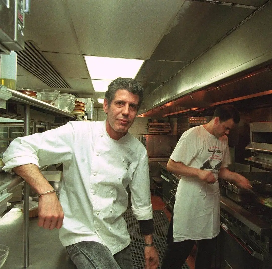 Anthony Bourdain in a white chef