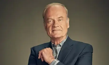 A studio portrait of actor Kelsey Grammer smiling slightly.