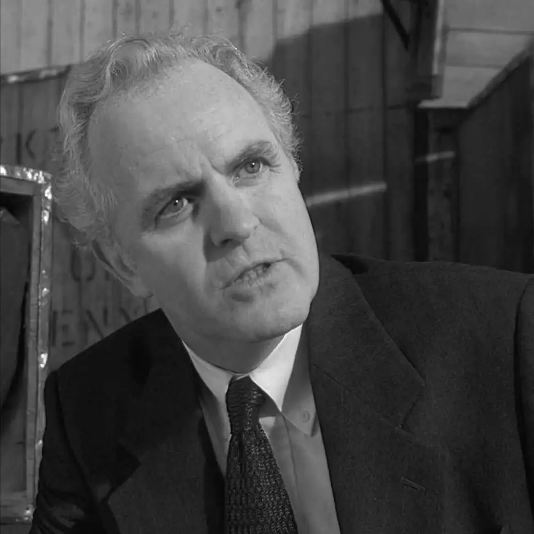 Black-and-white image of actor James Handy looking upward with a serious expression.