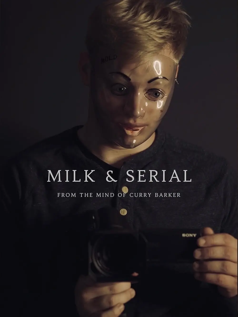 dark movie poster for "Milk & Serial" showing a person with blonde hair wearing a translucent plastic face mask while holding a Sony camcorder.