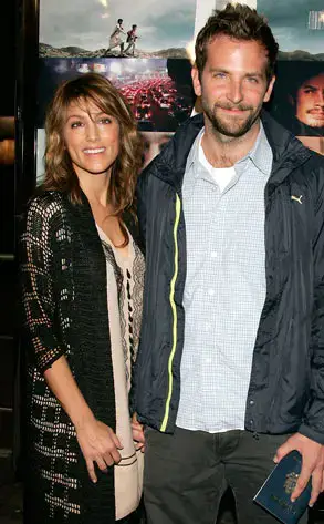 Jennifer Esposito wearing a black crochet cardigan next to Bradley Cooper in a blue zip-up jacket at the Los Angeles premiere of "Babel."