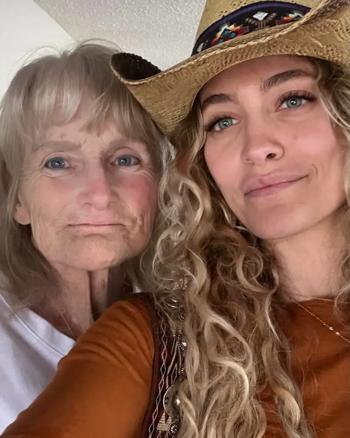 Paris Jackson in a straw cowboy hat poses for a close-up selfie alongside her mom Debbie Rowe.