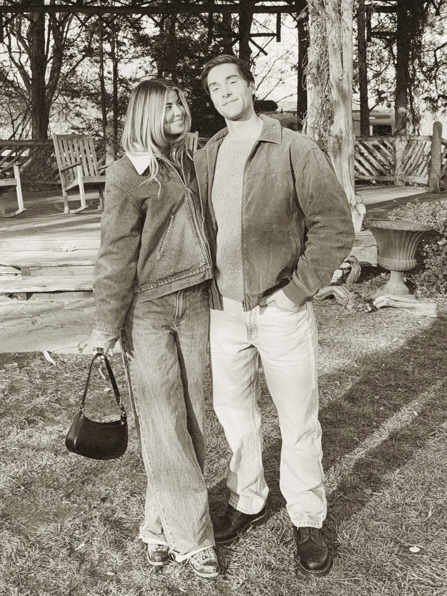 Austin North standing outdoors alongside his girlfriend Cali Fuller as she smiles up at him.