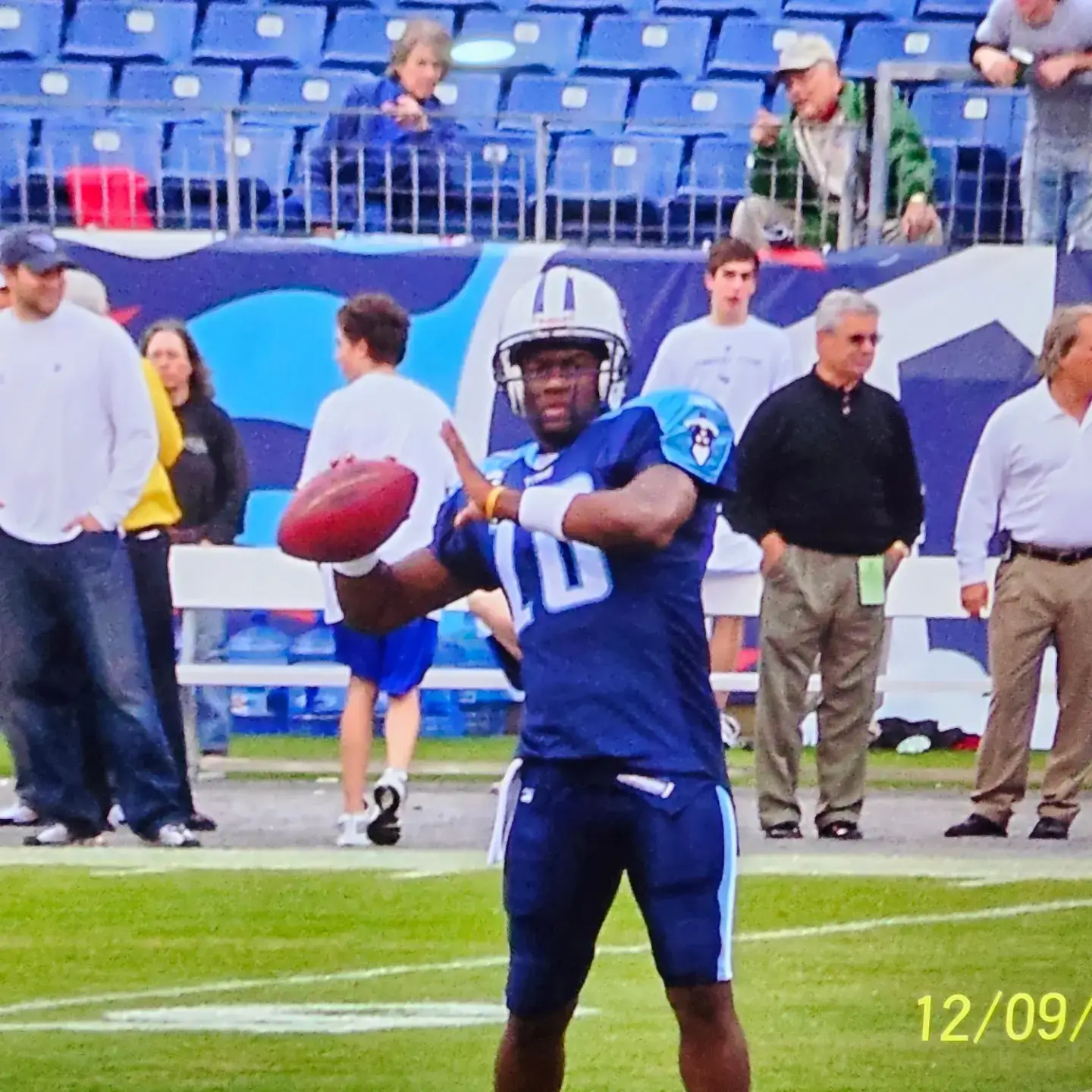 Vince Young winding up to throw a football during a game in his Tennessee Titans uniform.