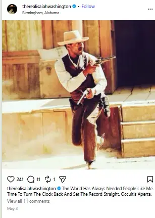 Isaiah Washington dressed as a 19th-century Western gunslinger in a cowboy hat and vest running forward while aiming revolvers.