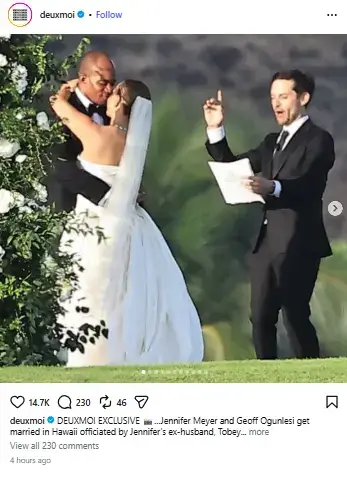 Tobey Maguire in a black suit officiating the outdoor wedding ceremony as bride Jennifer Meyer and groom Geoffrey Ogunlesi embrace and kiss.