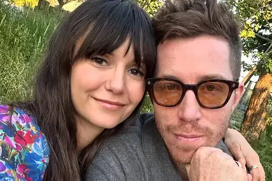 Selfie of Nina Dobrev and her ex-fiance, Shaun White, smiling at the camera.