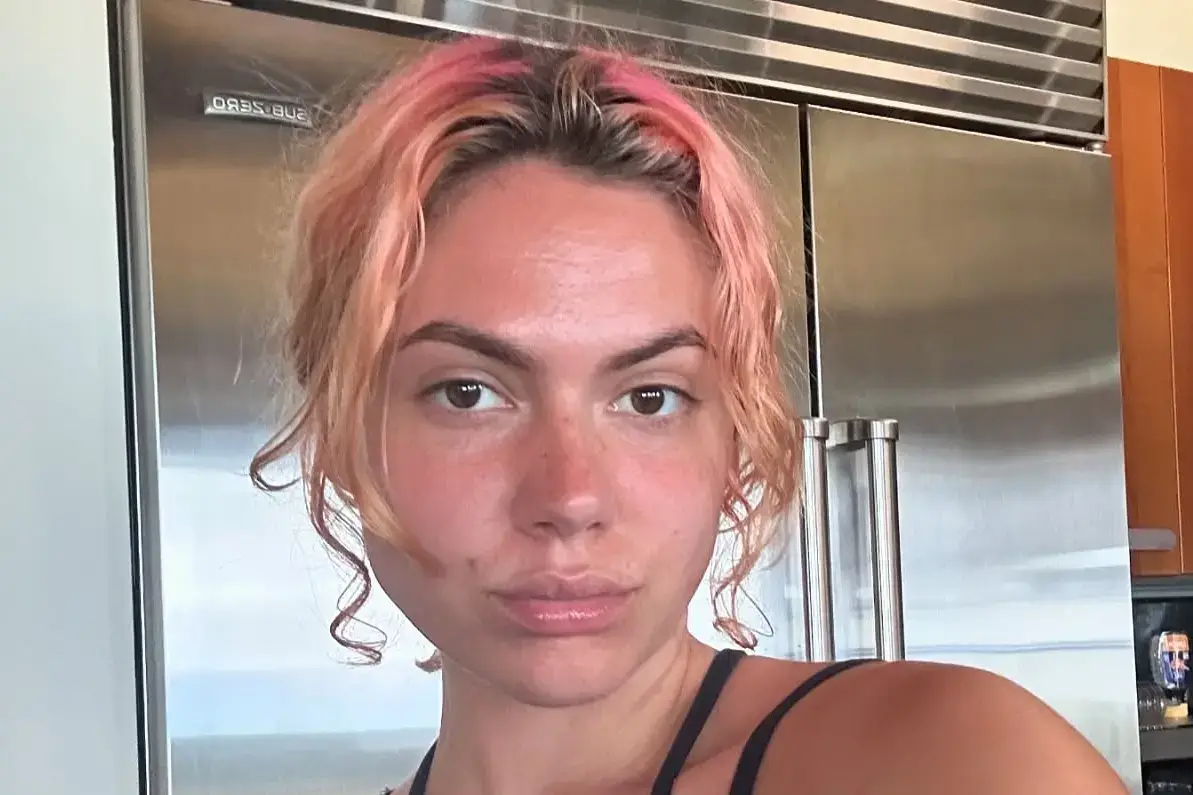 Calysta Bevier with light pink-tipped curly hair