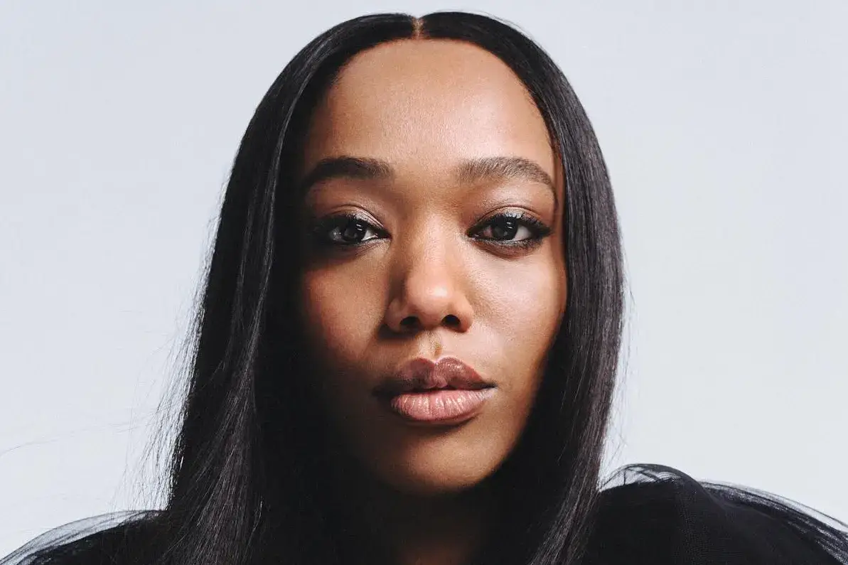 Naomi Ackie looking directly at the camera.