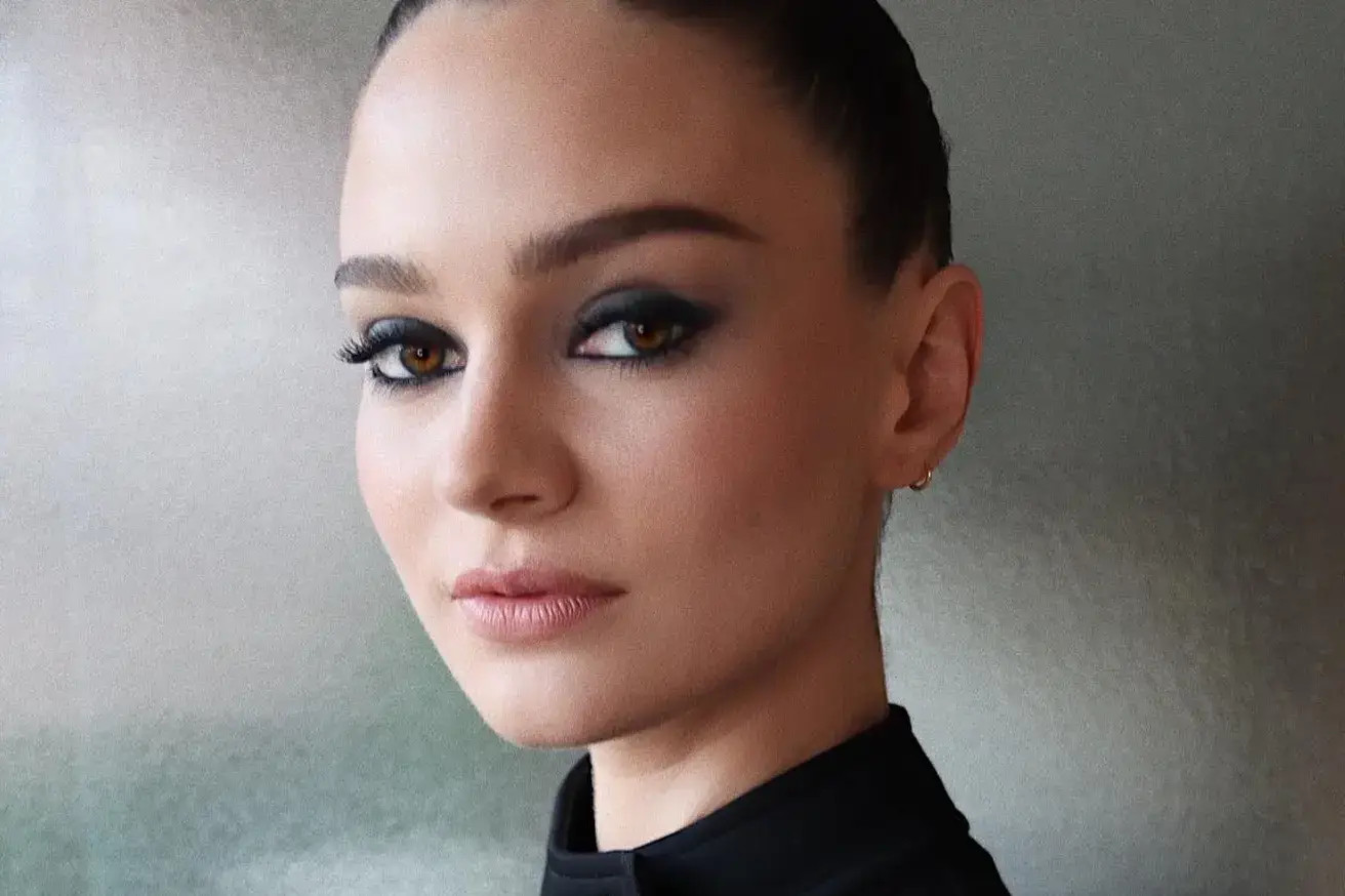 Aisling Franciosi looking directly into the camera.