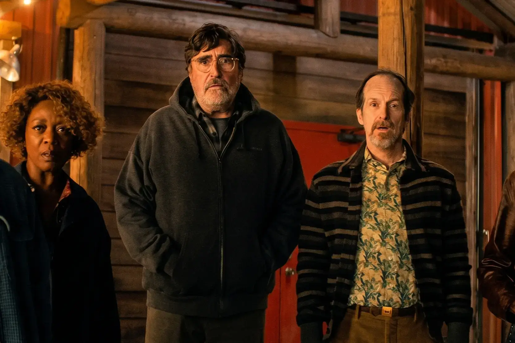 Alfred Molina, Denis O'Hare, and Alfre Woodard look ahead with expressions of shock.