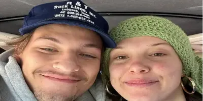 A smiling Millie Bobby Brown in a green knit hat is seen with her partner, Jake Bongiovi, in a blue