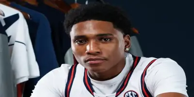 A close-up portrait of basketball player Tahaad Pettiford in a jersey.