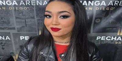 Roxanne Perez wearing a black leather jacket and a silver chain necklace.
