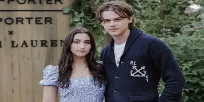 Christopher Briney and Isabel Machado stand side-by-side.