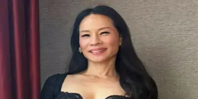 Headshot of Lucy Liu smiling.