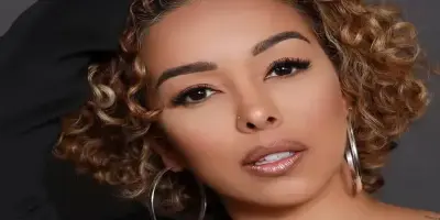 Gloria Govan with curly blonde hair.