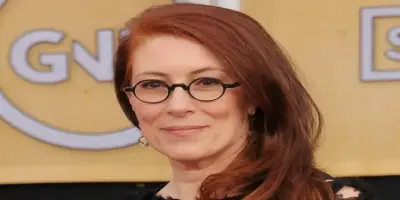 Jo Andres, with long reddish-brown hair.