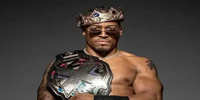 Professional wrestler Carmelo Hayes posing shirtless.