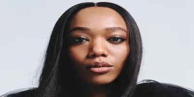 Naomi Ackie looking directly at the camera.