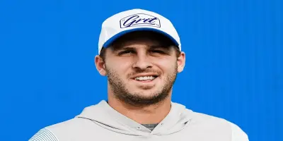 Detroit Lions quarterback Jared Goff smiling with a light beard.