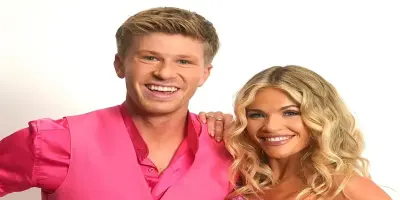 Robert Irwin in a pink vest and Witney Carson in a matching pink outfit.