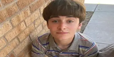 Actor Noah Schnapp, in character with his bowl-cut hairstyle.