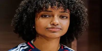 Soccer player Lily Yohannes with dark curly hair