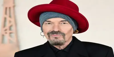 Billy Bob Thornton wearing a black coat.
