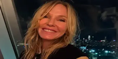 Kelli Giddish with long blonde hair.