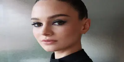 Aisling Franciosi looking directly into the camera.