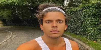 Rudy Mancuso wears a white ribbed tank top.