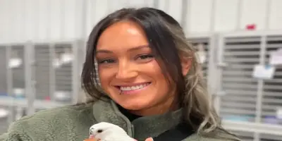 Kris Statlander holding the pigeon.