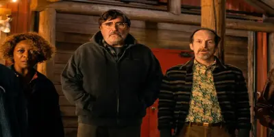 Alfred Molina, Denis O'Hare, and Alfre Woodard look ahead with expressions of shock.