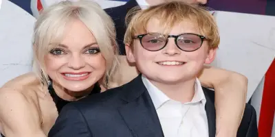 Anna Faris smiles warmly as she wraps her arm around her son, Jack Pratt, who is wearing glasses and