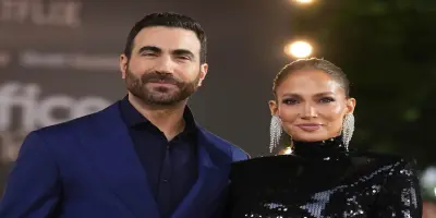 Brett Goldstein and Jennifer Lopez.