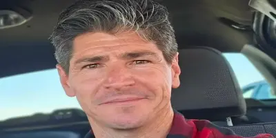 Michael Fishman smiling closely at the camera